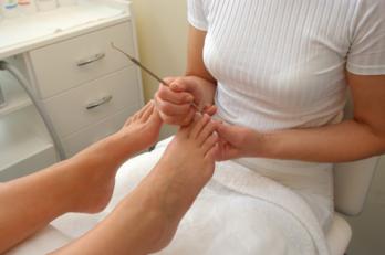 Chiropodist working on an ingrown toenail