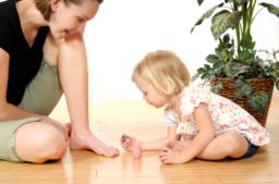 Taking care of mums toenails Toddler painting mums toenails