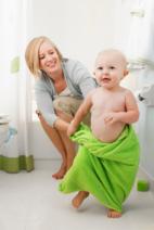 mum and baby at bath time